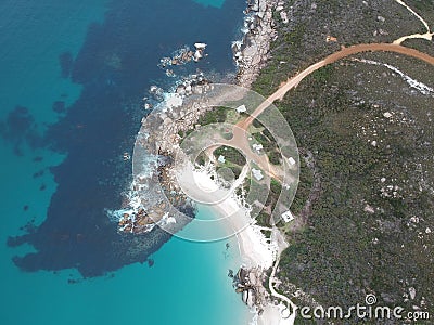 Aerial view of small shacks by the beach and rocks Stock Photo