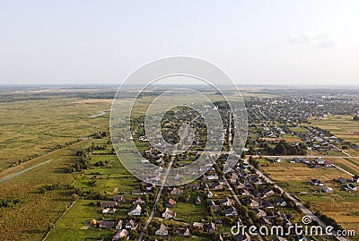 Aerial view of small village in Ukraine. Above view of rural area houses, cultivated fields and parcels, country roads Stock Photo