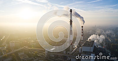 Aerial view of the smog over the city in the morning, smoking chimneys of the CHP plant and the city`s buildings Stock Photo