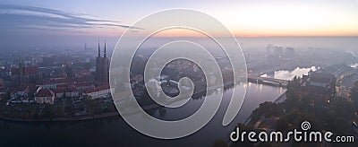 Aerial view of the smog over the waking city at dawn, in the distance buildings covered with fog and smog Stock Photo