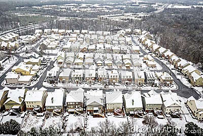 Aerial view snow fall on houses in Atlanta Georgia suburbs Stock Photo