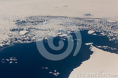 Aerial view of the snowy ice-covered landmass in Antarctica Stock Photo