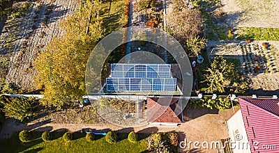 Aerial view of solar panals on the roof of small house Stock Photo