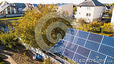 Aerial view of solar panals on the roof of small house Stock Photo