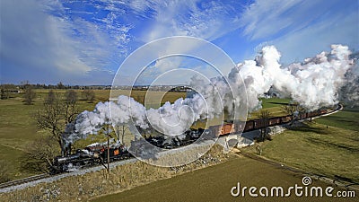Aerial View of a Steam Double-Header Freight , Passenger Train Approaching Blowing Lots of Smoke Editorial Stock Photo
