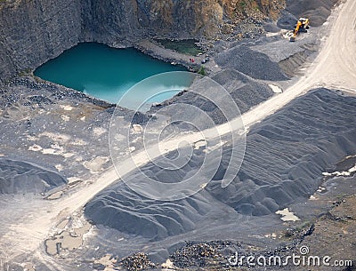 Aerial view : Stone quarry with a turquoise pond Stock Photo