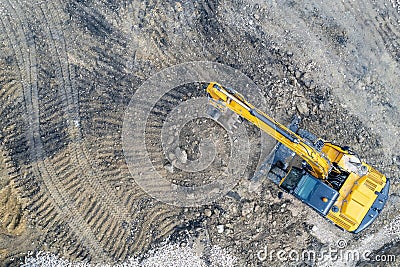 stopped yellow excavator at a construction site Stock Photo