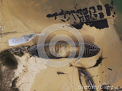 Aerial view of stranded broken wooden shipwrecks boat graveyard marine cemetery in Magouer Etel river Brittany France Editorial Stock Photo