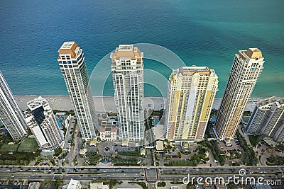 Aerial view of Sunny Isles Beach city with congested street traffic and luxurious highrise hotels and condos on Atlantic Editorial Stock Photo