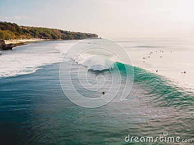 Aerial view of surfer at barrel wave. Perfect waves and surfers in ocean Stock Photo