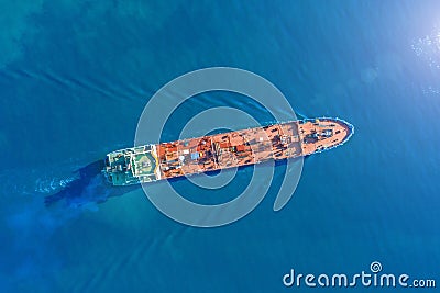 Aerial view tanker ship with liquid bulk cargo is sailing in blue water. Stock Photo