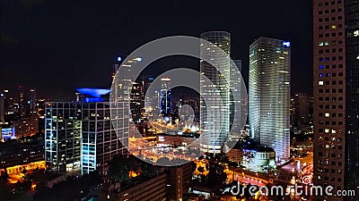 Aerial view on Tel-Aviv. Urban night city never stops. Luxury building and tall business towers Stock Photo