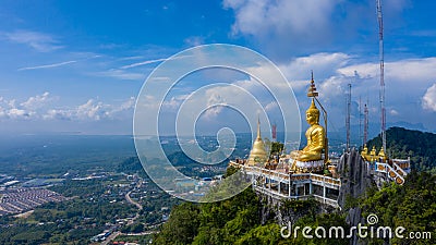 Aerial view Tiger Cave Temple, Buddha on the top Mountain with blue sky of Wat Tham Seua, Krabi,Thailand Stock Photo