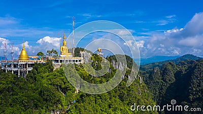 Aerial view Tiger Cave Temple, Buddha on the top Mountain with blue sky of Wat Tham Seua, Krabi,Thailand Stock Photo