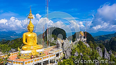 Aerial view Tiger Cave Temple, Buddha on the top Mountain with blue sky of Wat Tham Seua, Krabi,Thailand Stock Photo