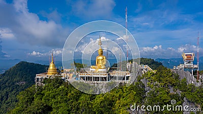 Aerial view Tiger Cave Temple, Buddha on the top Mountain with blue sky of Wat Tham Seua, Krabi,Thailand Stock Photo