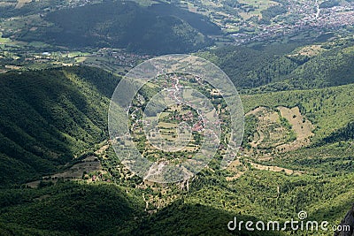 Aerial view to hilly countryside with settlement Stock Photo