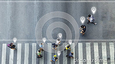 Aerial view and top view with blur man with smartphone walking converse with busy city crowd move to pedestrian crosswalk. concept Stock Photo