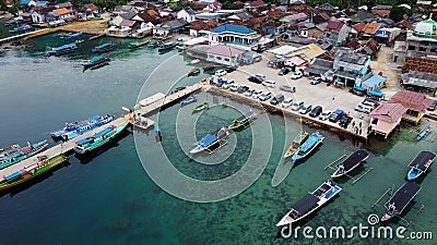 Aerial view of top down picture of colorful wooden boats. Boats at the pier. Lampung, Indonesia Jan 20, 2021 Editorial Stock Photo