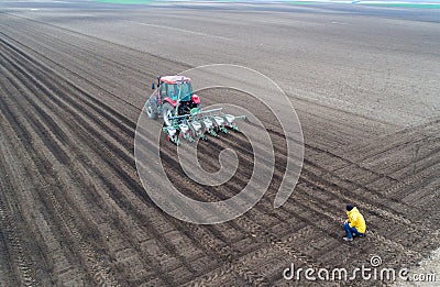 Aerial view of tractor sowing soil Stock Photo