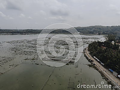 Aerial view of traditional floating fish pond on swamp in Indonesia Editorial Stock Photo