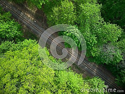 Aerial view of a train railroad in the green forest. children`s narrow gauge railway Stock Photo
