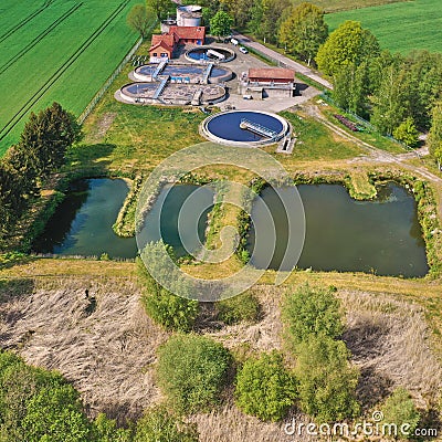 Aerial view of a treatment plant for dirty wastewater with primary clarifier, aeration tank and secondary clarifier Stock Photo