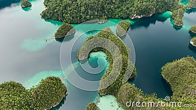 Aerial View Of Triton Bay In Raja Ampat Islands: Lagoon With Turquoise Water And Green Tropical Trees. Wide Angle Nature Stock Photo