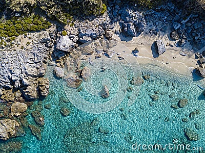 Aerial view of Tropea beach, crystal clear water and rocks that appear on the beach. Calabria, Italy. Swimmers, bathers floating Stock Photo