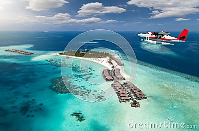 Aerial view of a tropical island with seaplane approaching, Maldives Stock Photo