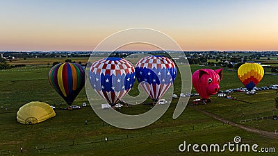 Aerial View on Two Hot Air Balloons Launching, in the Early Morning, From a Field in Rural America Editorial Stock Photo