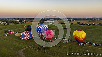 Aerial View on Two Hot Air Balloons Launching, in the Early Morning, From a Field in Rural America Editorial Stock Photo