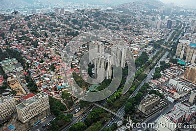 Aerial view of the Valle-Coche highway and the popular neighborhoods of San Agustin in Caracas, Venezuela Stock Photo