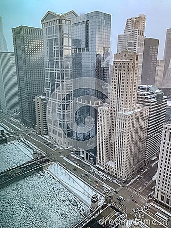 Aerial view of Wacker Drive and frozen Chicago River as sunset begins to reflect off of skyscrapers Editorial Stock Photo