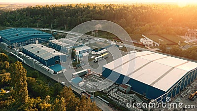Aerial view of warehouse storages or industrial factory or logistics center from above. Aerial view of industrial buildings Stock Photo