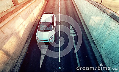 Aerial view of white car entering underground garage Stock Photo