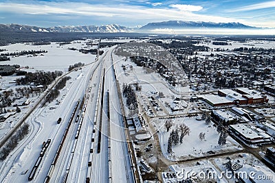 Aerial view of Whitefish, Montana on a cloudy winter day with the Rockies n the background Stock Photo