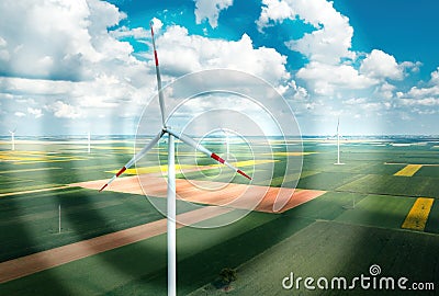 Aerial view of wind turbines on modern wind farm from drone pov, digitally enhanced image Stock Photo