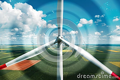 Aerial view of wind turbines on modern wind farm from drone pov, digitally enhanced image Stock Photo