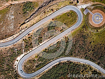 Aerial view of winding road and heliport for emergencies. Stock Photo