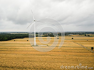Aerial view of windmill against cloudy sky Stock Photo