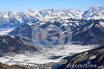 Aerial view of winter Austria village, Zell am See lake and sunny Alp mountains Stock Photo