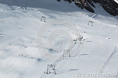 Aerial view of winter slopes of Alp mountains in sunny Austria Stock Photo