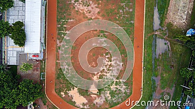 Aerial view of a work day off in the morning at the school stadium. Overhead aerial drone flight over sports people Editorial Stock Photo