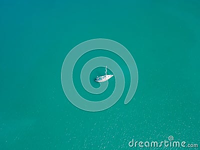 Aerial view yacht at sea in blue sea water texture Stock Photo