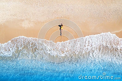 Aerial view of the young lying woman on the sandy beach near sea Stock Photo