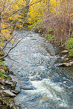 Whetstone Brook Vermont in Fall from covered bridge Stock Photo