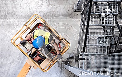 Aerial of a worker on a cherry picker Stock Photo