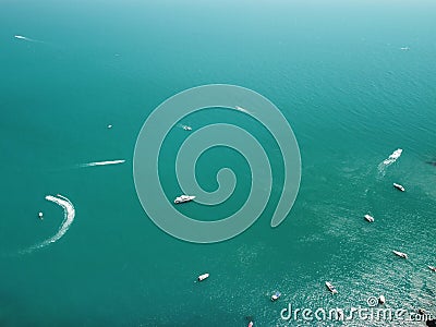 Aerial yacht on calm sea. Luxury cruise trip. View from above of white boat on deep blue water. Aerial view of rich Stock Photo