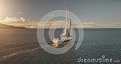 Aerial yacht regatta race at open sea. Amazing seascape of ocean waters at sun reflections Stock Photo